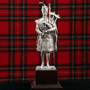 Silver Plated 8.5" Scots Guard Piper statue on wooden plinth